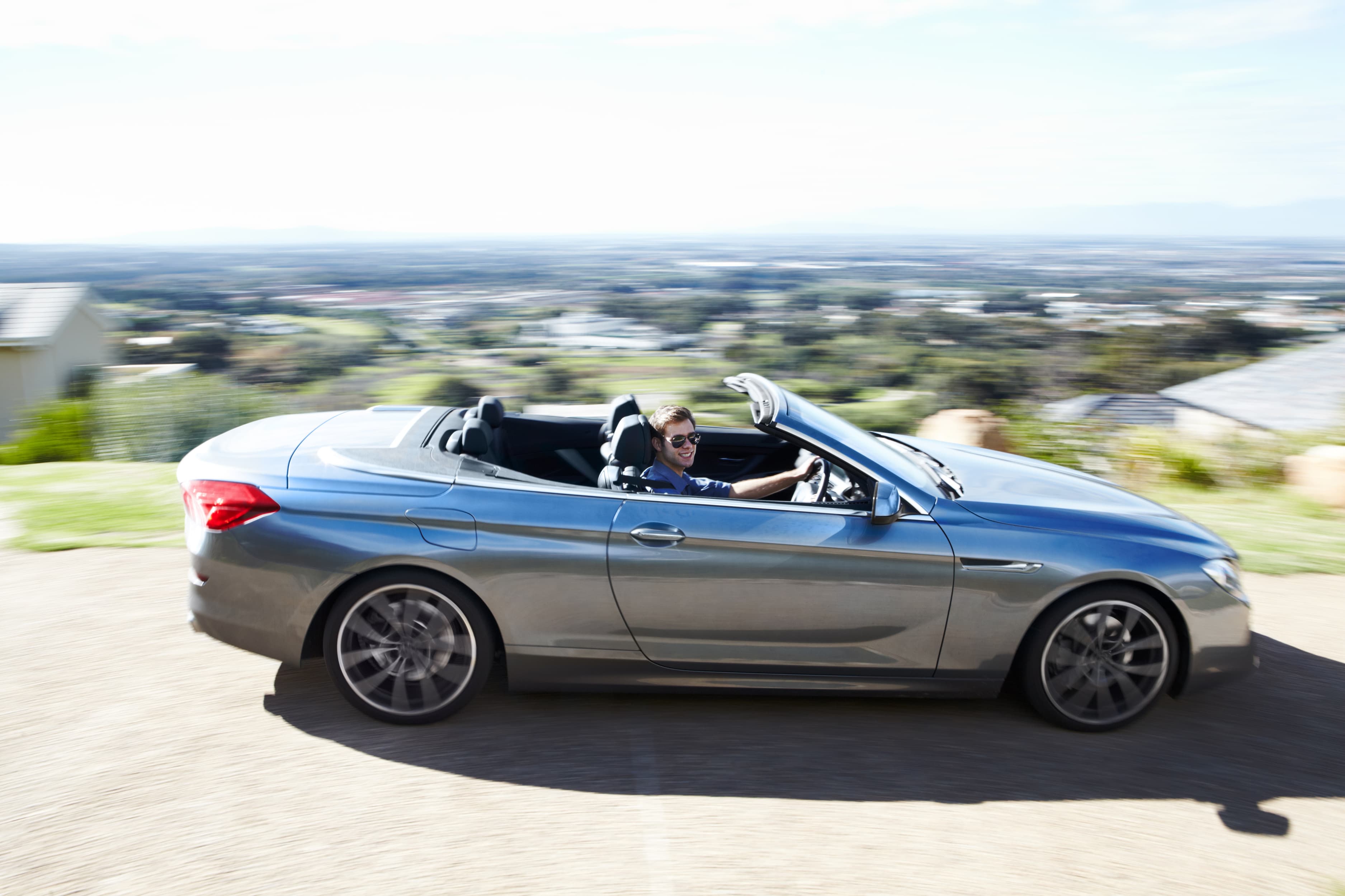 Driver in a convertible car