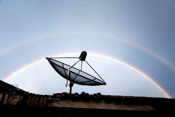 Geostationary satellites - a normal satellite? satellite dish on the roof against rainbow sky 2022 08 01 04 26 23 utc 600x400 - Geostationary satellites - a completely normal satellite?