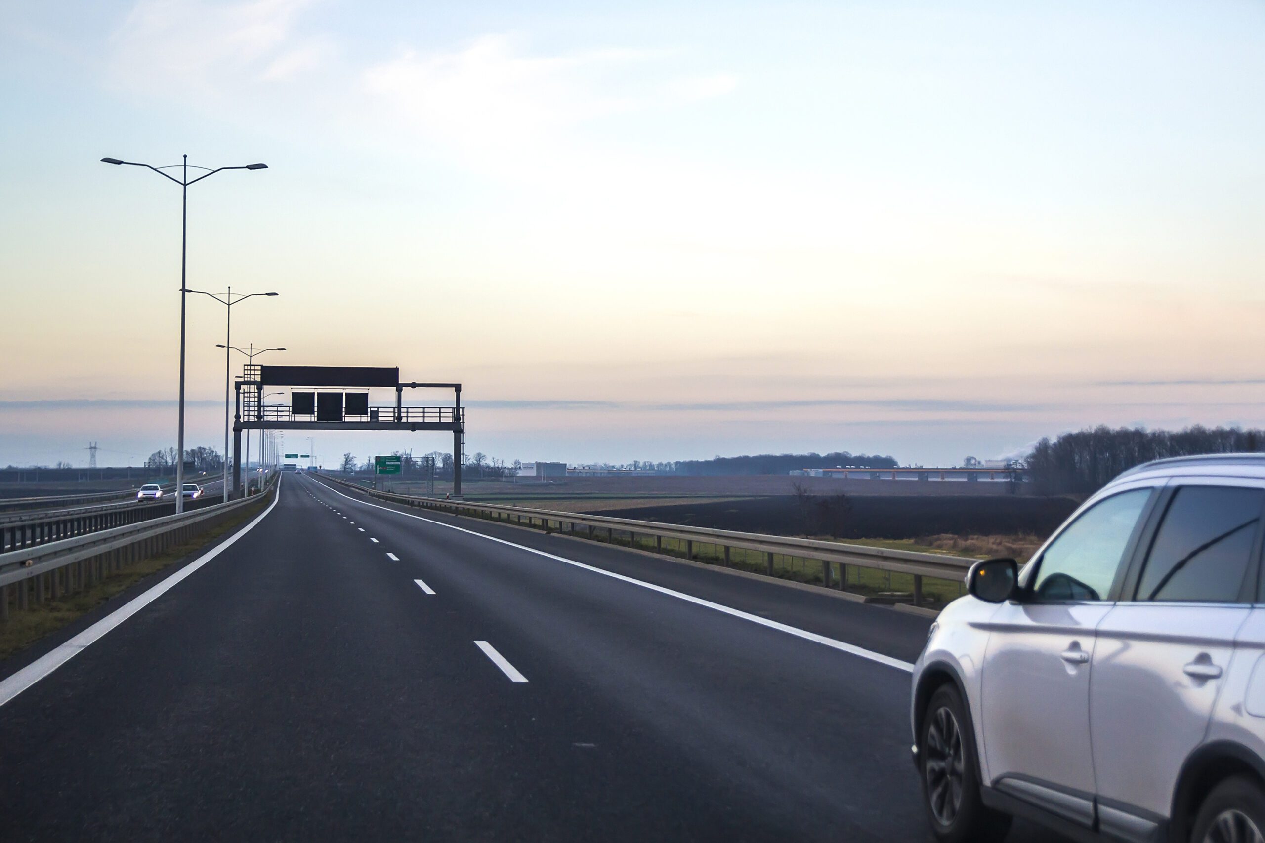 car on highway with blank directional road signs 2022 11 07 23 33 03 utc scaled - recommended speed in Germany on the highway